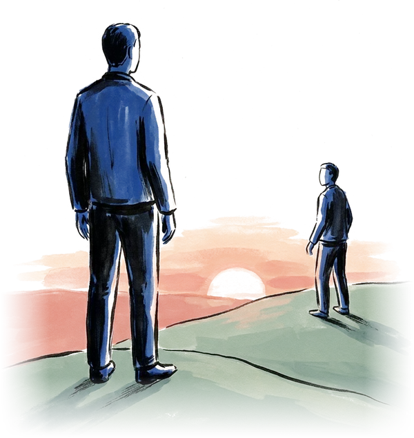Two people standing on a hill at sunset